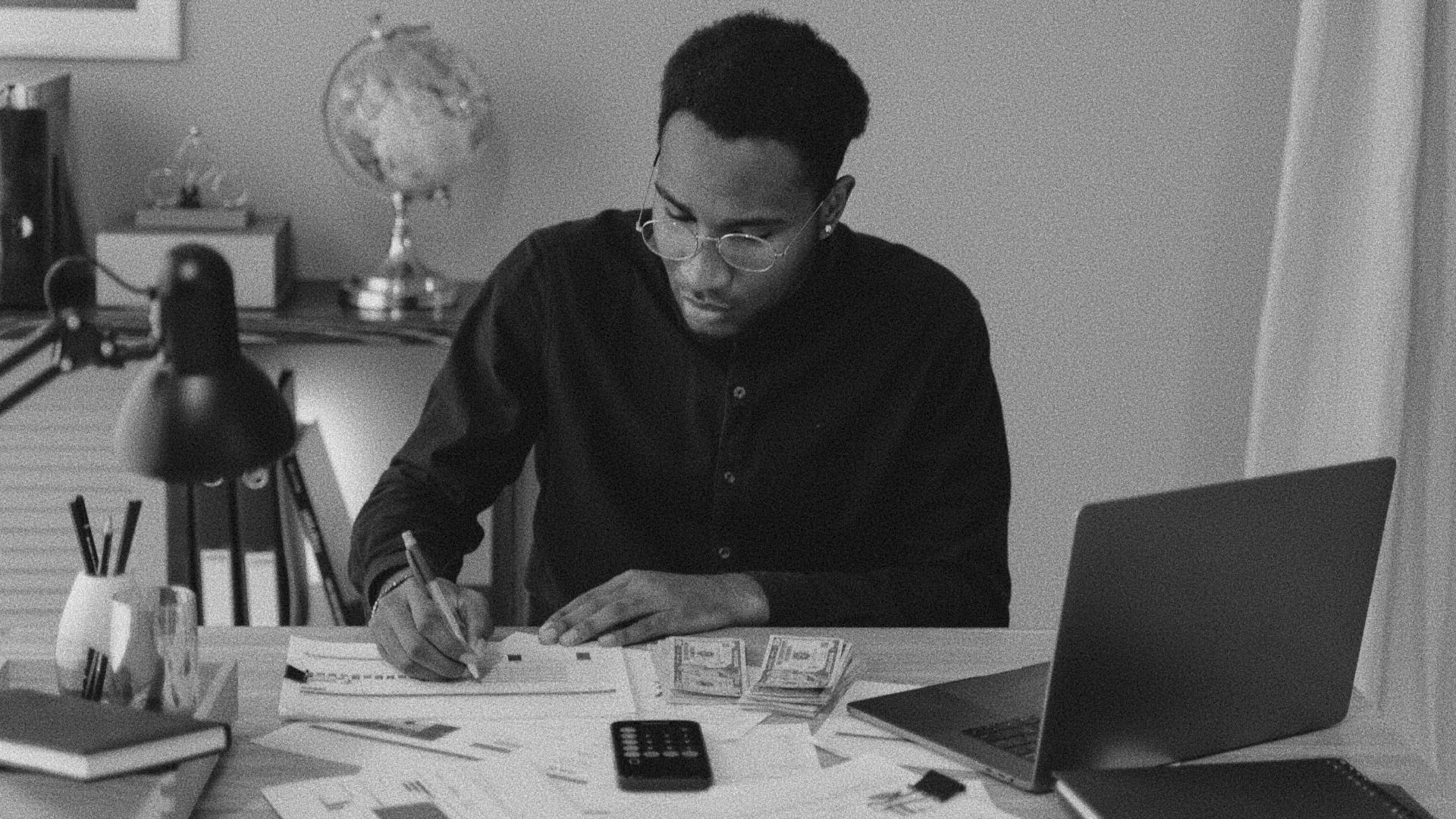 Business owner reviewing email at a desk after fixing mail authentication records.