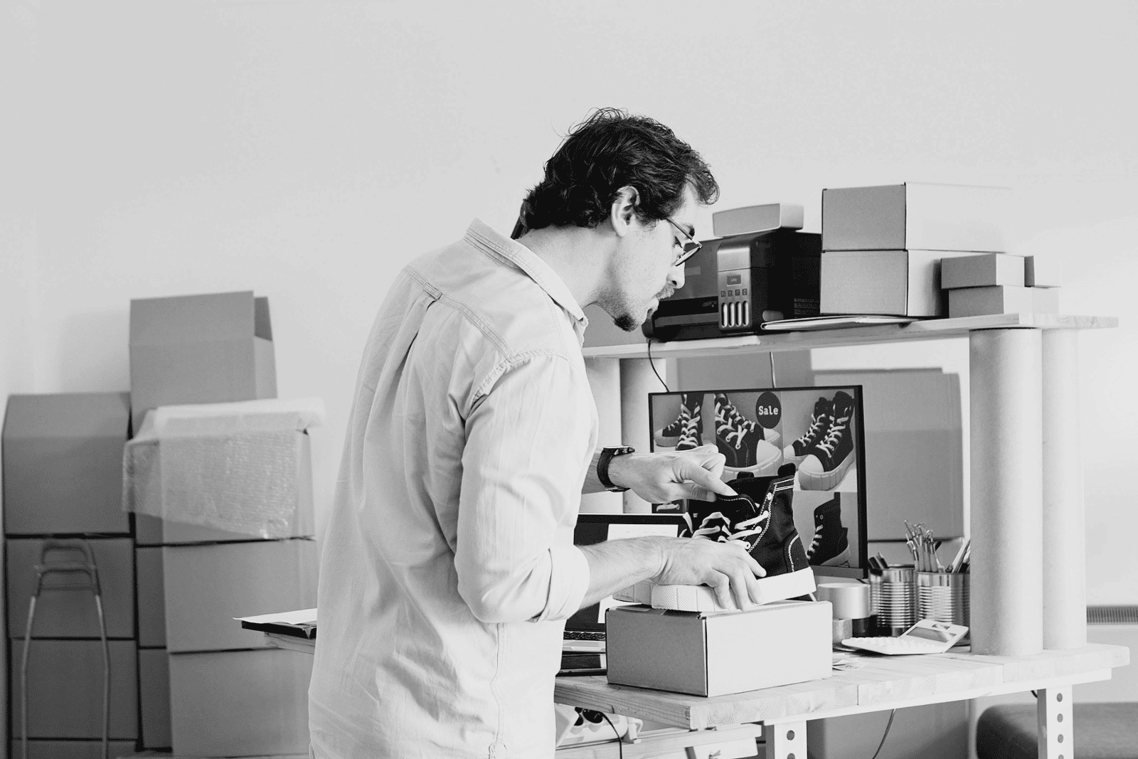 A small business owner packing products.
