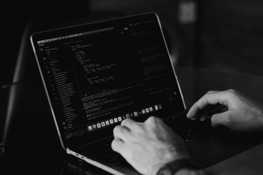 A programmer automating a script in an application.