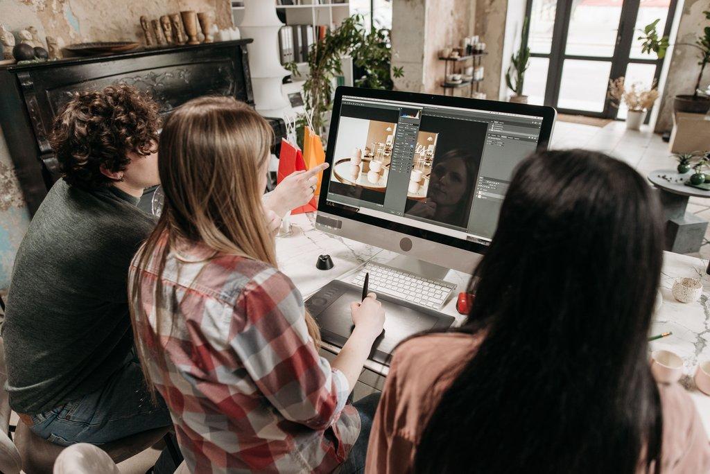 Agency team managing multiple WordPress sites across screens.