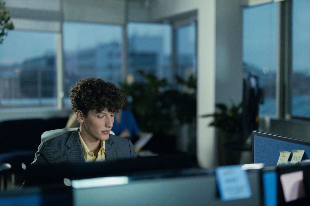 Business owner checking sales figures on a laptop.