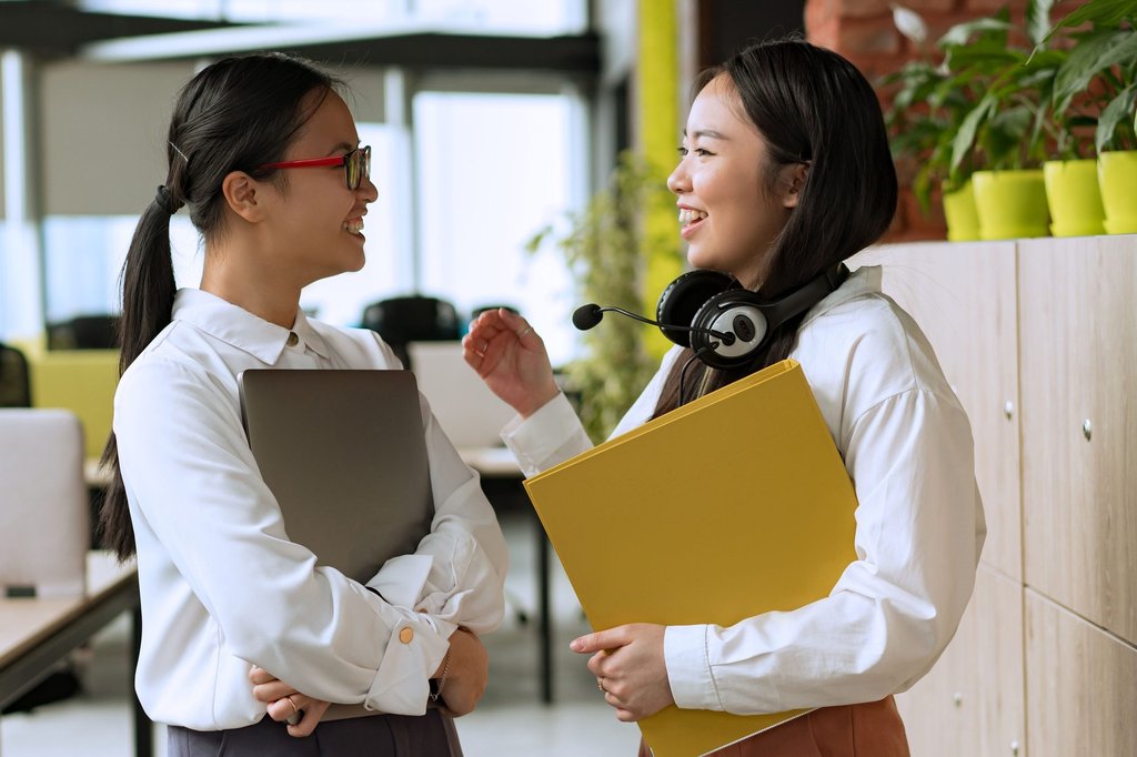 Accounting firm staff reviewing client deadlines together at a desk.