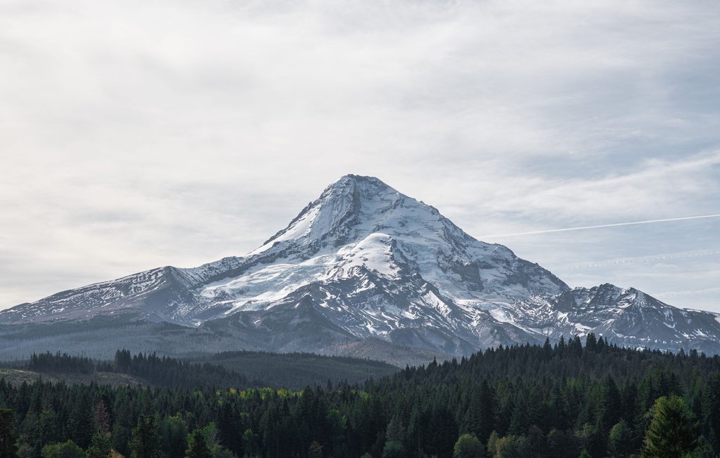 Mount Hood under snow, seen across the Oregon landscape.