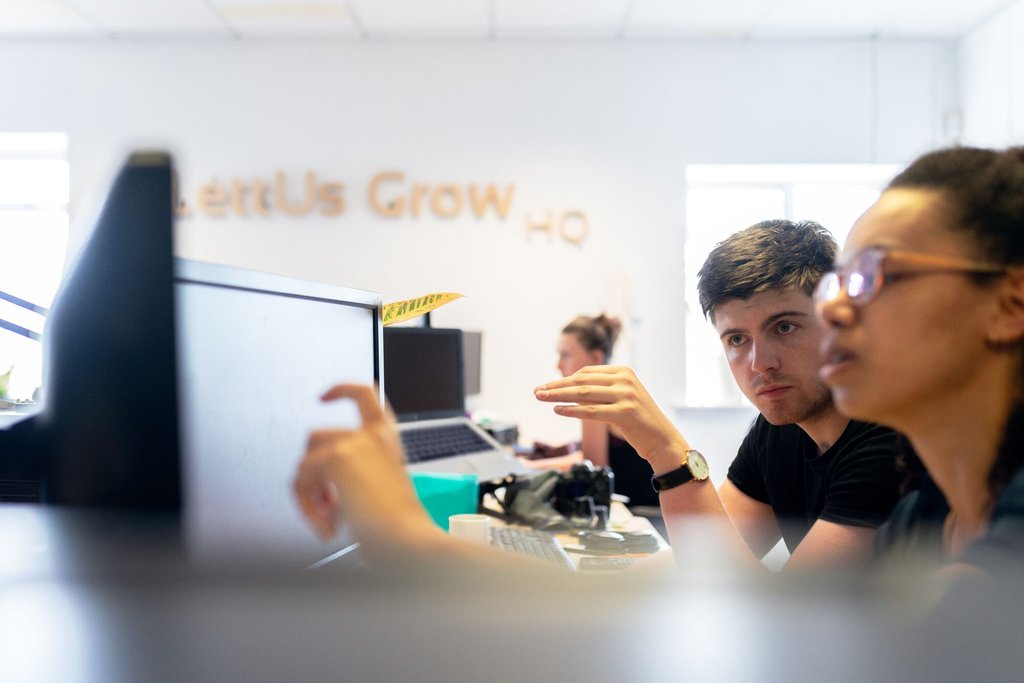 Two colleagues working from one system that holds both staff and finance records